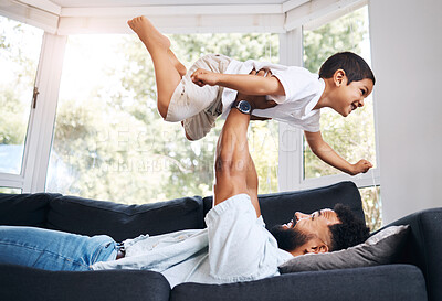 Buy stock photo Dad, kid and support flying in home, parent lifting and fun with airplane fantasy in living room. Father, balance child and bonding together by playing games, weekend laughing and love for freedom