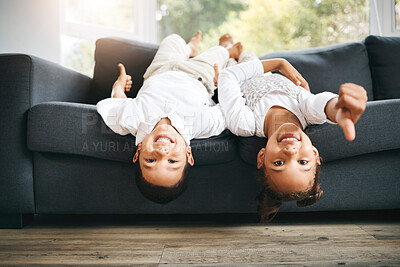 Buy stock photo Portrait, upside down or happy kids on sofa with thumbs up, care or smile with games in family house. Girl, boy and playful children siblings bonding on couch together for yes sign, okay or agreement