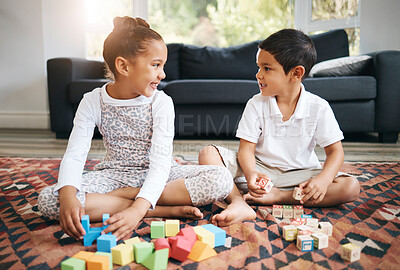 Buy stock photo Children, siblings and building blocks for learning in home, cognitive development and education. Kids, brother and sister bonding together on living room floor, creative puzzle and shape games