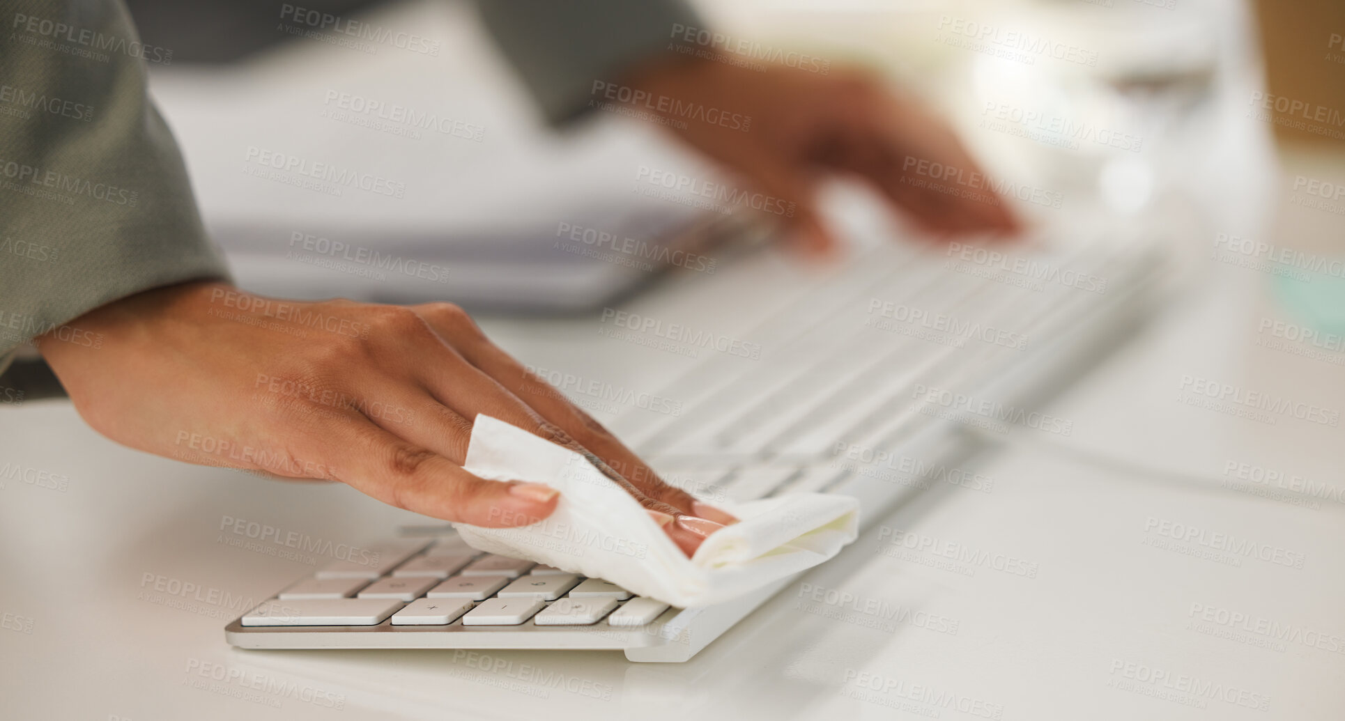 Buy stock photo Hands, keyboard and cleaning with tissue, wipe and sanitizer at office desk for hygiene or wellness. Person, employee and technology for disease prevention, safety and infection in corporate business