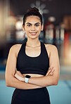 Happy training woman in gym, wellness athlete and exercise fitness. Healthy motivation portrait, sportswear equipment and slim person standing proudly and confident face after cardio workout 