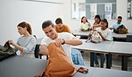 University students in a classroom, learning education at college in a diversity rich environment. Young men and women get stationary from backpack, to study and learn.