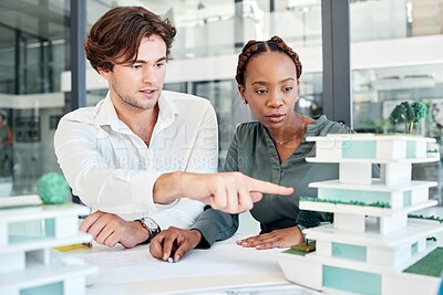 Buy stock photo Architecture, man and woman with building model, discussion or talk for planning construction or collaboration project. Engineer, architect or teamwork for blueprint design, brainstorming or creative