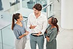 Tablet, meeting and collaboration with a business team talking strategy in their office together from above. Teamwork, internet and planning with a man and woman employee group in discussion at work