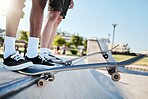 Fitness, shoes and skateboard friends training at skateboard for health, exercise and hobby in summer. Feet, balance and men stepping for halfpipe, skating and prepare body for physical performance