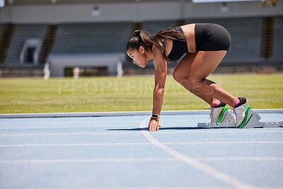 Buy stock photo Running, sports and fitness with an asian woman athlete on a track for a race, marathon or endurance training. Health, workout and exercise with a female runner at the start of a competitive sport