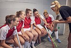 Hockey, girl team and coach with strategy, sports game and teamwork with coaching and planning for game. Fitness, exercise and young female athlete, workout and training for field sport and active.