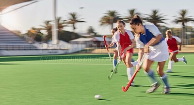 Buy stock photo Sports, hockey and women in action on field playing game, match and training in outdoor stadium. Fitness, exercise and blur of female athletes running with speed for victory, winning and score goal