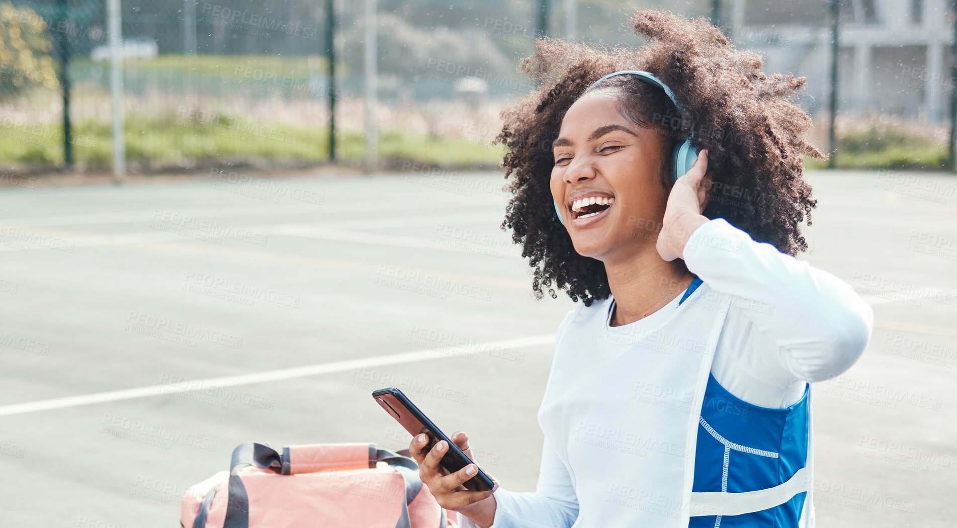 Buy stock photo Netball sports, smartphone music or happy woman listen to mp3 radio, audio podcast or media song after fitness training. Relax wellness, digital headphones or African athlete streaming sound on court