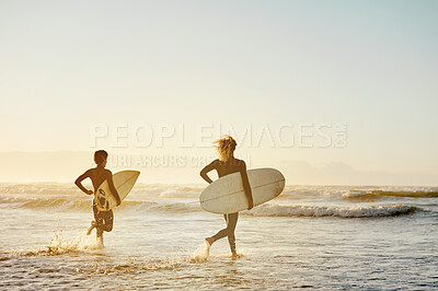 Buy stock photo Beach, surfboard and men running, sunset and water sports in fun, healthy lifestyle or fitness. Male athletes, friends or surfers on tropical island, holiday and seaside vacation for break or mockup