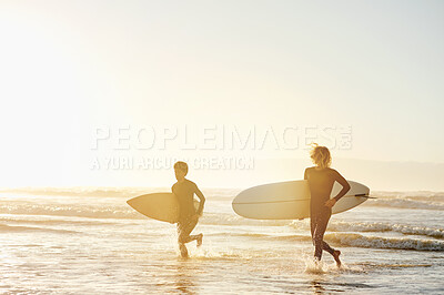 Buy stock photo Sunset, surfboard and men on beach running together in evening waves on surf holiday in Hawaii. Surfer friends, fun mockup and freedom in water sport on surfing vacation adventure and sunrise ocean