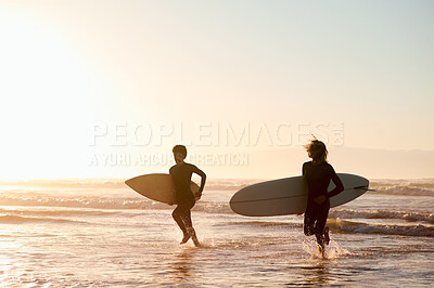 Buy stock photo Sunset, beach and friends running with surfboard for ocean fitness while on holiday or vacation mockup. Water sport, travel and men surfers practicing surfing while on tropical weekend trip together