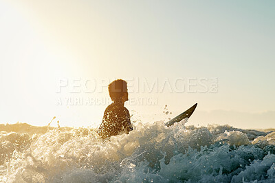 Buy stock photo Surf, water splash and blue sky with a sports man in the ocean for training outdoor in nature. Surfing, sea and fitness with a male athlete on his surfboard for his hobby or activity in summer