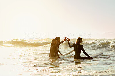Buy stock photo High five, surfer group and friends in sea ready for water sport in the ocean. Beach mockup, vacation sunset and motivation of young people together with a surfboard about to start surfing