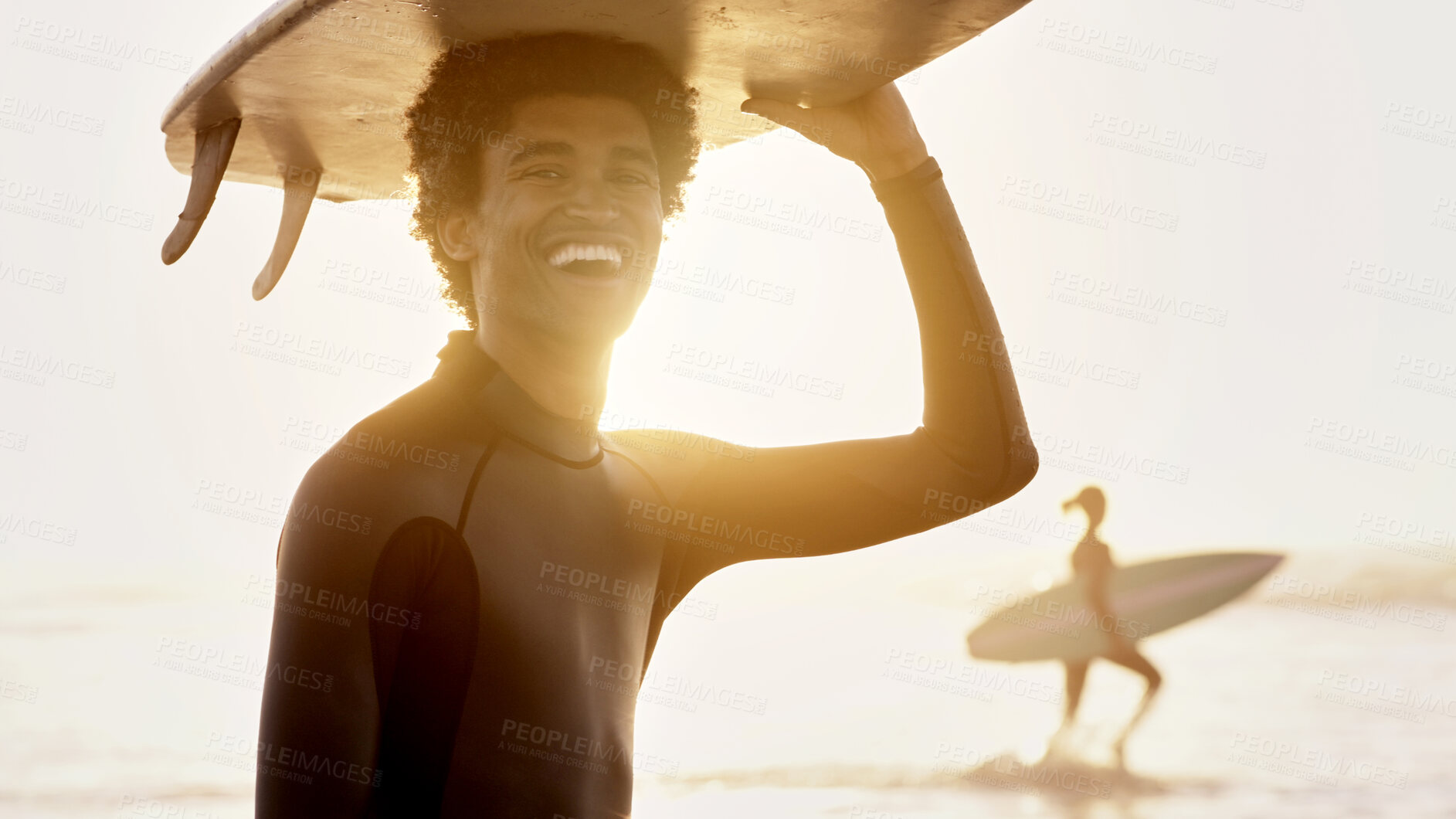 Buy stock photo Portrait of happy man, sunset and surfing board on head at beach for summer, freedom and fun. Surfer, guy and laughing at sea, sunshine and adventure for holiday, break or tropical vacation and smile
