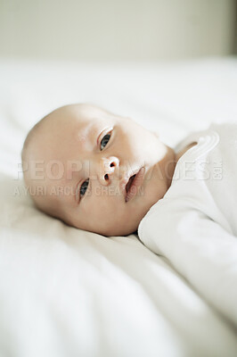 Buy stock photo Baby, nursery and young newborn on a home bedroom in the morning calm and relax. Healthy boy, small child face and a house with a toddler ready for a nap, sleeping and rest on a duvet and blanket