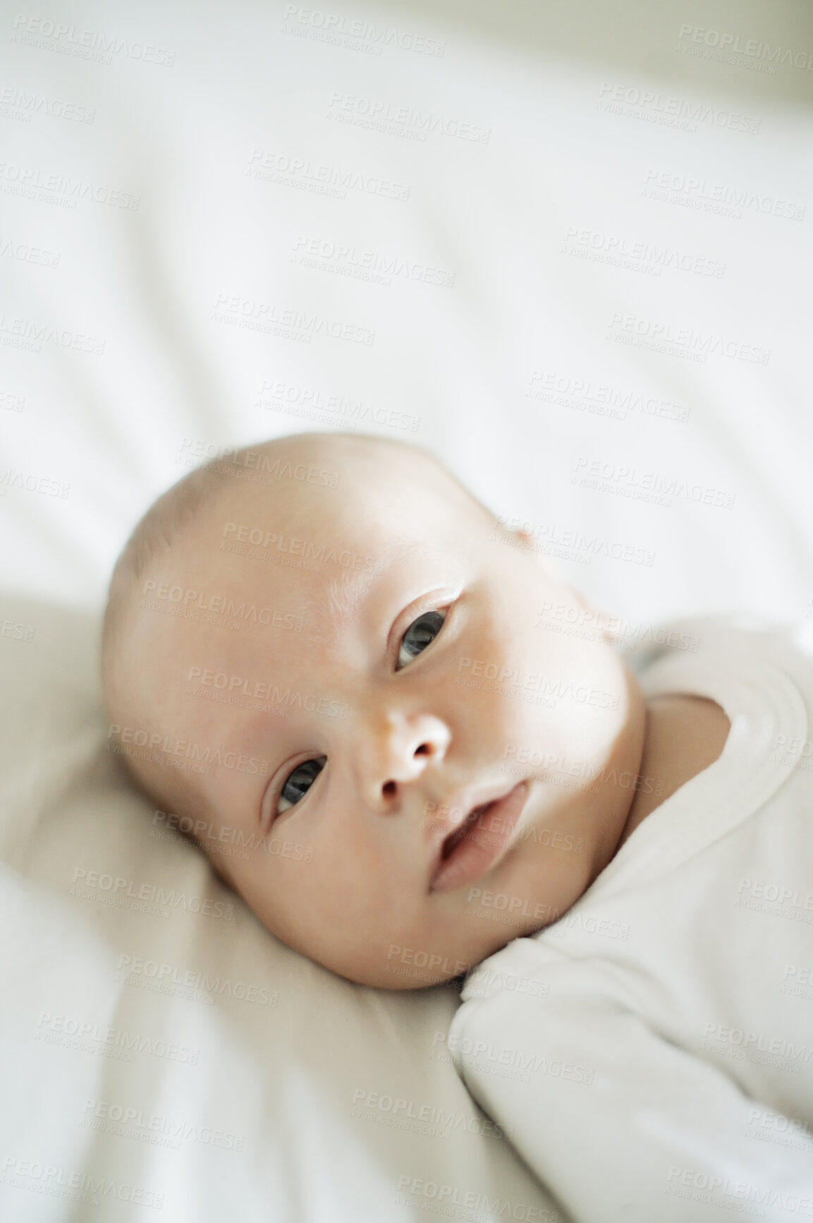 Buy stock photo Face of baby lying on bed in room, house and home for comfortable lifestyle, childcare or infant babies. Cute little newborn kids relax in bedroom nursery for healthy development, growth or calm rest