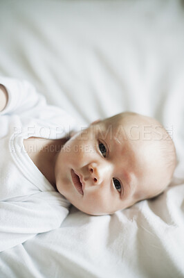 Buy stock photo Baby, home portrait and young newborn in a nursery bedroom in the morning calm and relax. Healthy smile, child face and a house with a toddler ready for a nap, sleeping and rest on duvet and blanket