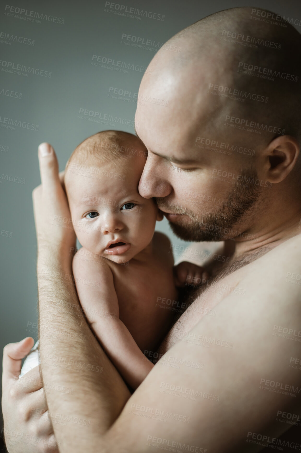 Buy stock photo Family, baby and father with a man hugging his child in studio on a gray background for tender or gentle love. Babies, parent and children with a man holding his newborn infant while bonding together