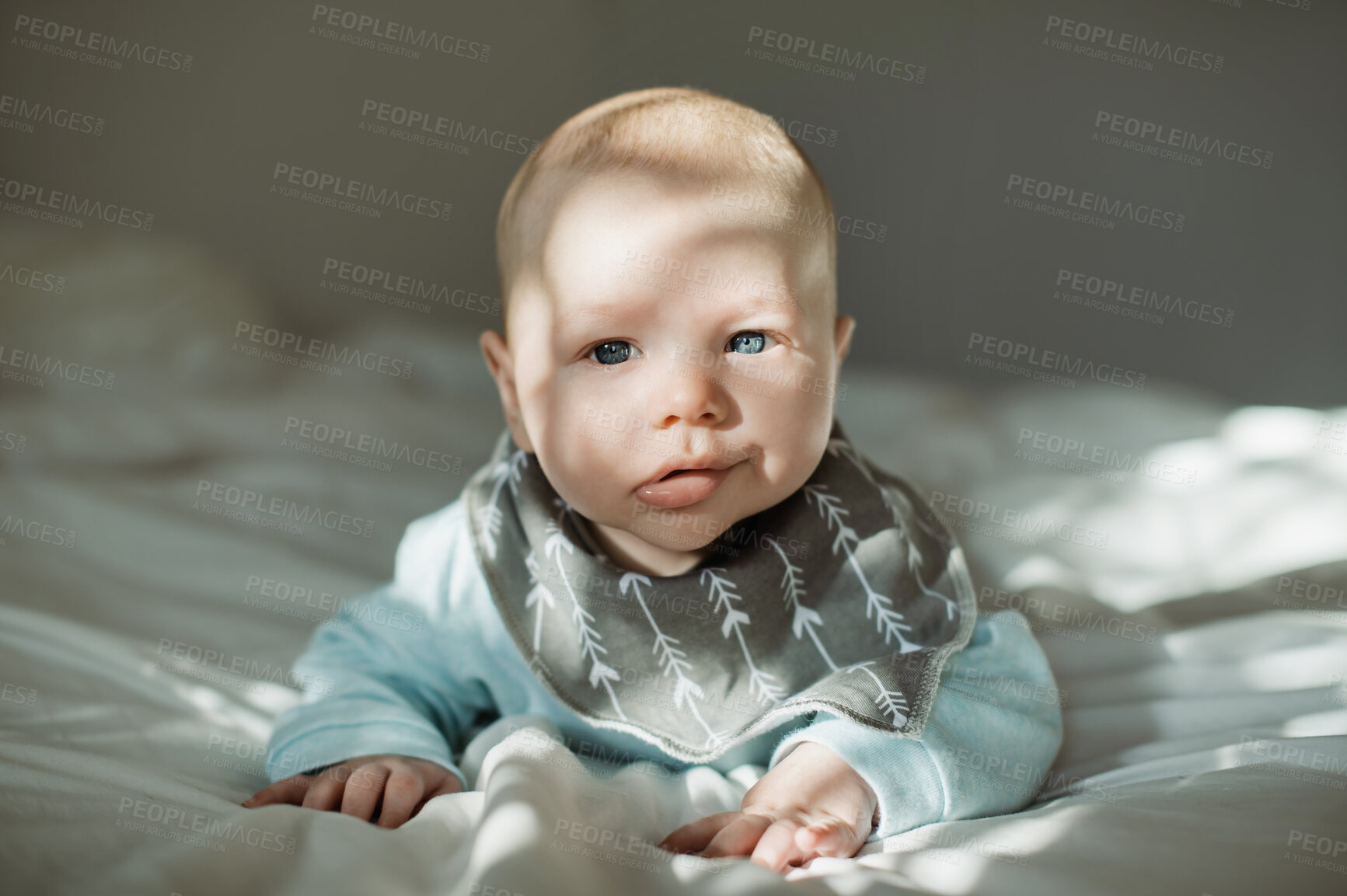 Buy stock photo Cute, innocent and portrait of a baby on a bed resting, relaxing and playing alone in his nursery. Adorable, newborn and face of infant boy child from Australia lying in the bedroom of a modern home.