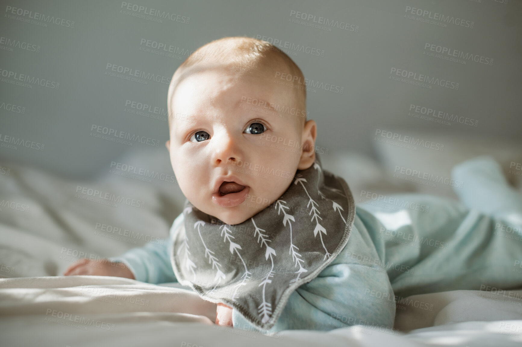 Buy stock photo Cute, adorable and portrait of a baby on a bed relaxing, resting and laying after playing. Young, innocent and little boy infant or newborn child lying in his nursery or bedroom in the modern house.