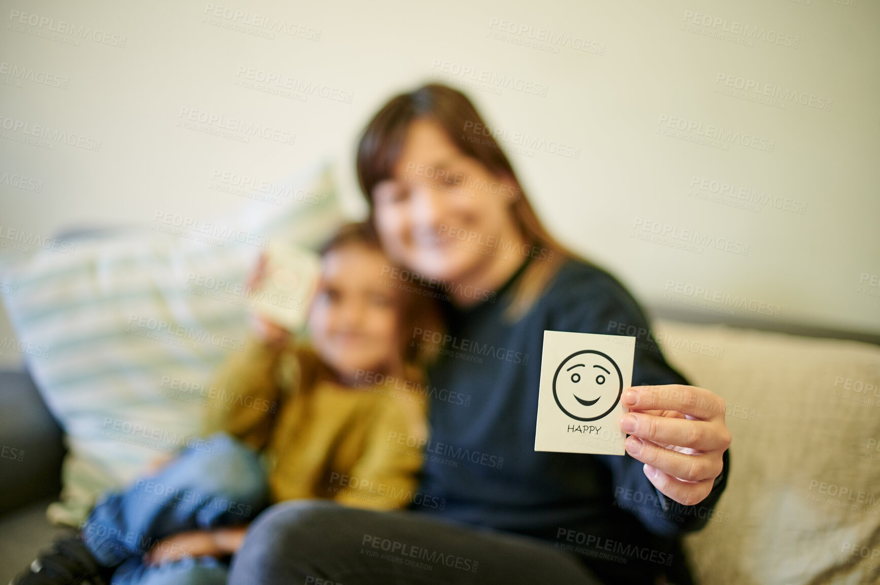 Buy stock photo Happy, therapist and a child with an emotion card, showing reaction and feelings in therapy. Together, care and blur of a psychologist with a kid for counseling and working on emotional intelligence