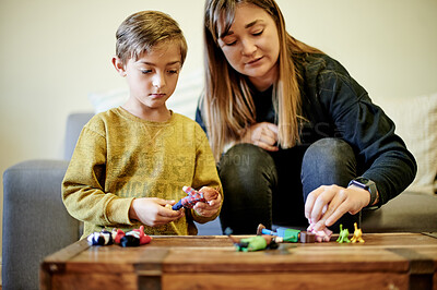 Buy stock photo Mother, child and playing with toys in home, bonding and having fun together. Care, development and mama with boy or kid play with toy, learning and education while enjoying quality time in house.