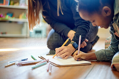 Buy stock photo Color, drawing and art with kid and teacher on floor of classroom for learning, education and teaching. Creative, sketching and child development with young girl and woman at school for picture