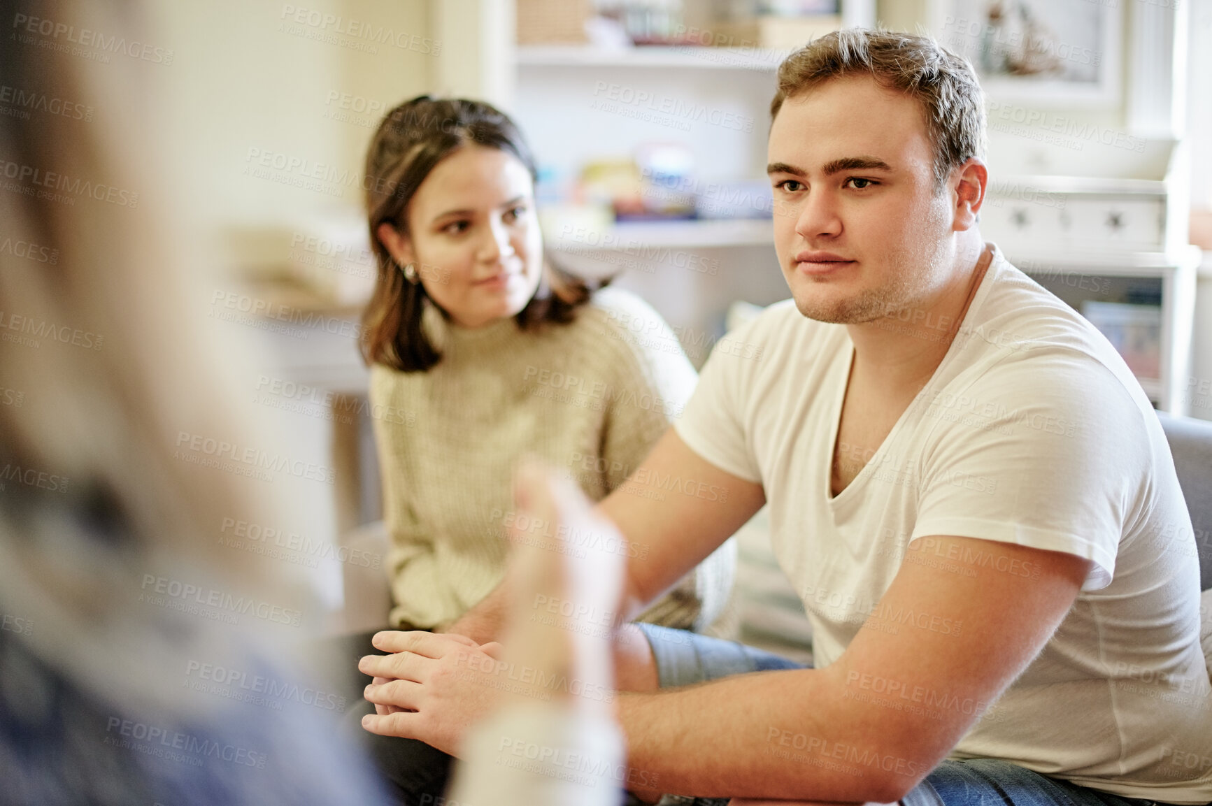 Buy stock photo Mental health, support and talking couple in therapy with understanding for marriage counselling and sharing feelings. Psychology, man and woman sitting on couch together with therapist for advice.