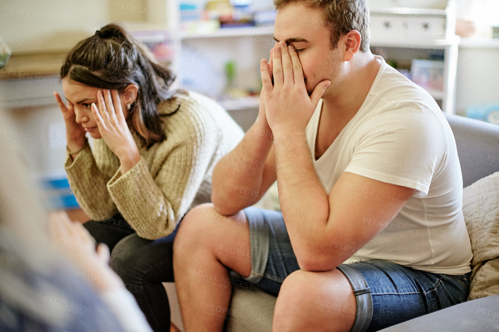 Buy stock photo Therapy, frustrated and upset couple in counseling session, consulting and relationship conflict on sofa. Psychology, therapist and unhappy man and woman with marriage fail, divorce problem and sad