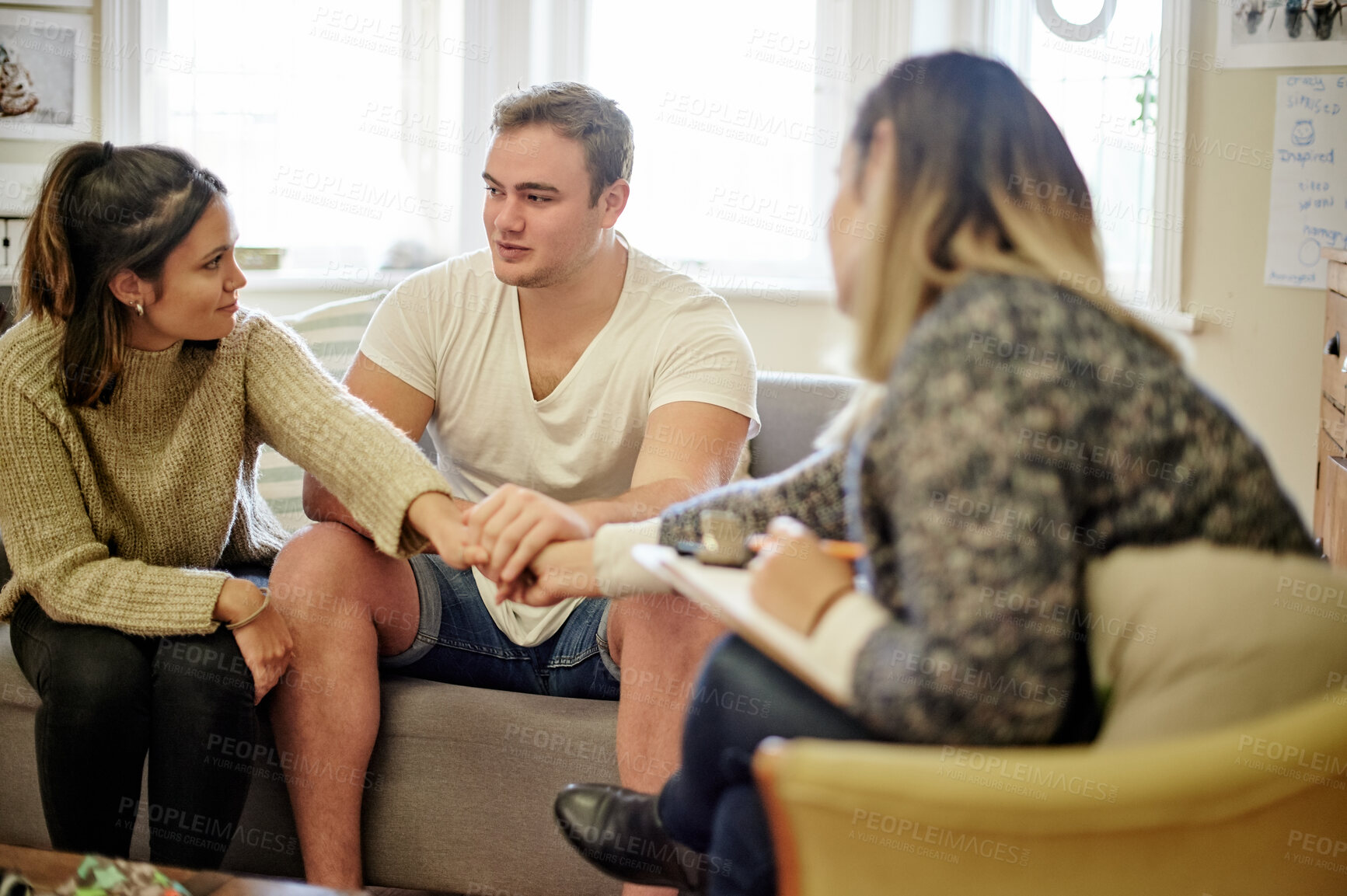 Buy stock photo Marriage, counselling and holding hands by couple consulting with therapist for help, support or advice. Psychology, therapy and man with woman in consultation room for guidance, care or healing