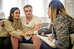 Marriage, counselling and couple holding hands while consulting with therapist for help, support or advice. Psychology, therapist and man with woman in consultation room for guidance, care or healing