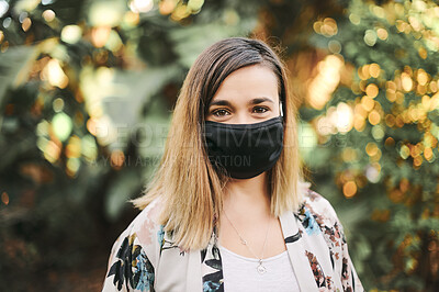 Buy stock photo Woman, portrait and covid face mask in outdoor garden with bokeh light background in nature with health safety. Happiness, corona and protection masks for young female in summer park during pandemic 