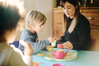 Buy stock photo Mother, kids and play tea party in home, having fun and bonding together. Relax, children and drinking from toy cup with mama playing game with boys for imagination, childhood or pretending in house.