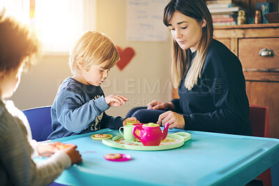 Buy stock photo Mother, kids and play tea party in home, having fun and bonding together. Relax, children and drinking from toy cup with mama playing game with boys for imagination, childhood or pretending in house.