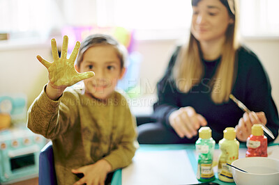 Buy stock photo Painting, hand and art with child and teacher in classroom for learning, education and creative. Inspiration, lesson and color with young boy and woman at school for teaching, drawing and hobby