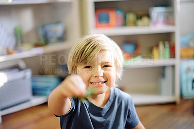 Buy stock photo Happy, smile and portrait of boy child in his nursery playing with his toys for childhood development. Happiness, excited and face of toddler kid from Australia having fun in his playroom in his home