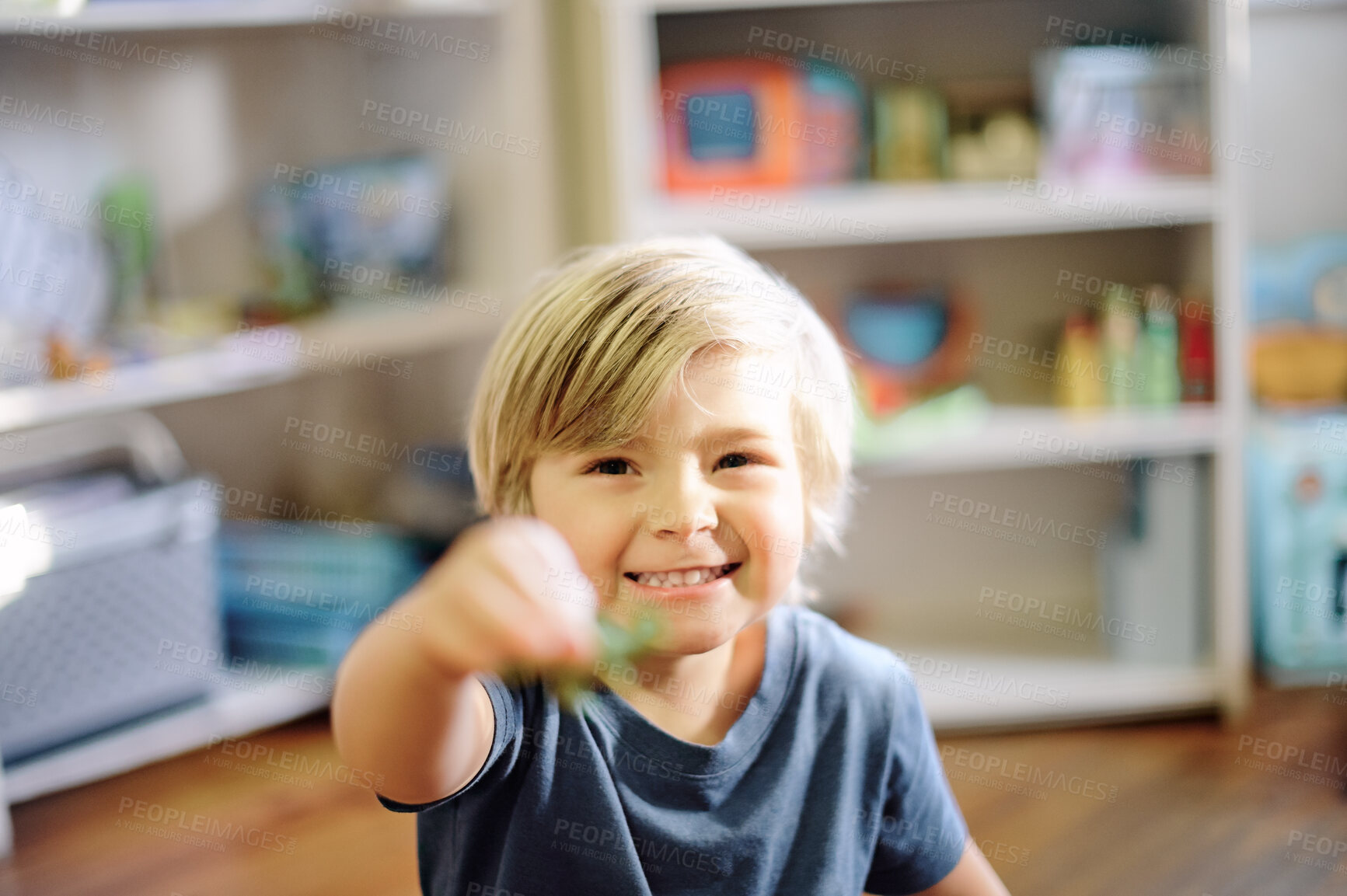 Buy stock photo Happy, smile and portrait of boy child in his nursery playing with his toys for childhood development. Happiness, excited and face of toddler kid from Australia having fun in his playroom in his home