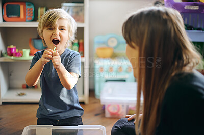 Buy stock photo Fun, playful and the portrait of a child with a teacher for play therapy and mental development. Happy, education and a student with a woman for playing, childcare and counseling in a classroom