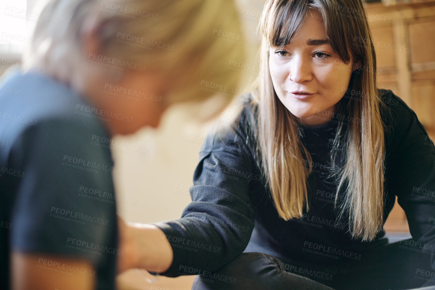 Buy stock photo Therapy, comfort and therapist speaking to a child on autism, adhd or mental health in a clinic. Psychology, healthcare and female kid psychologist talking to a young boy in office at wellness center