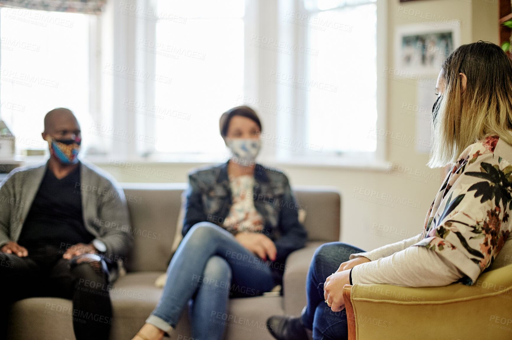 Buy stock photo Interracial couple, woman therapist and expert for marriage counseling  in a consultation room. Communication, listening and people at a psychology and consulting appointment ready for support