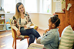 Psychologist, black kid and consultation in office for support, help or mental health. Psychology, therapist and girl consulting happy woman for counselling, therapy or talking for advice in clinic.