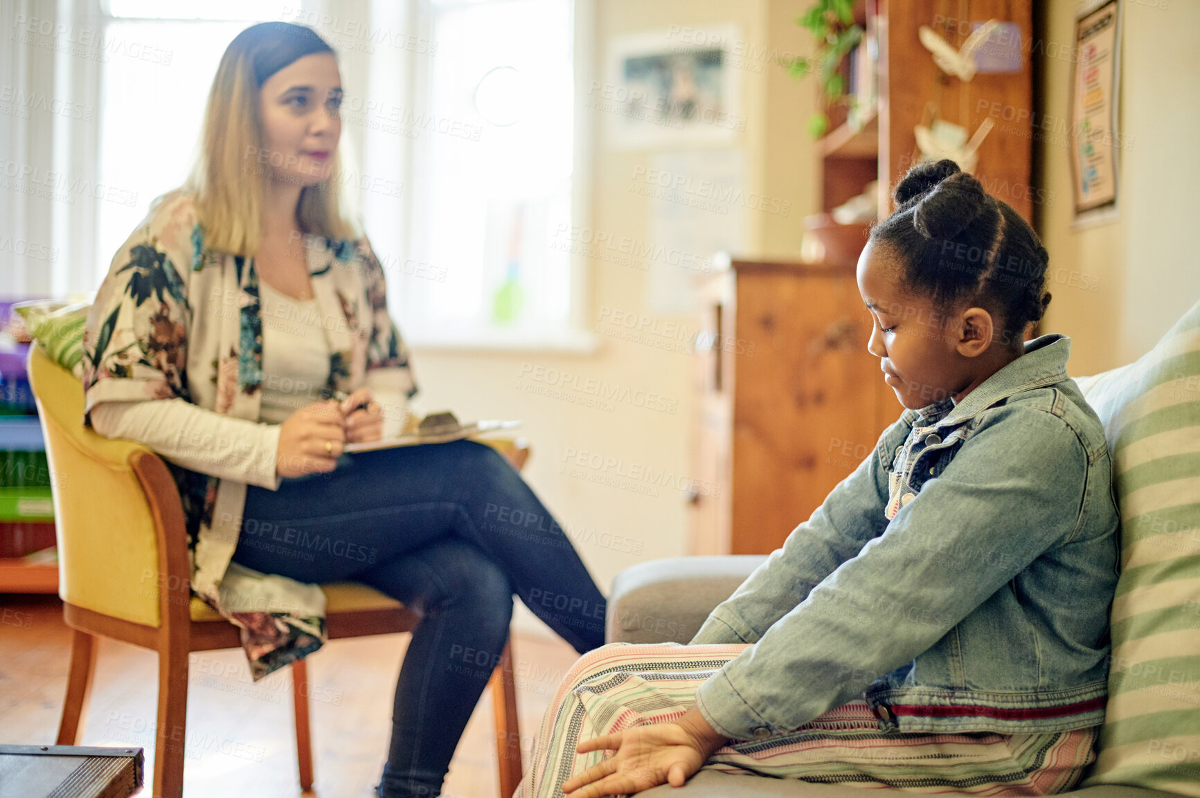 Buy stock photo Psychologist, black kid and consultation in office for depression, anxiety or mental health. Psychology, therapist and sad girl consulting woman for counselling, therapy advice or talking in clinic.