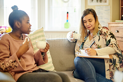 Buy stock photo Child talking and psychologist writing on clipboard, therapy evaluation or assessment report for support in consultation. Tea, relax and therapist woman, checklist and kid trauma or counseling help