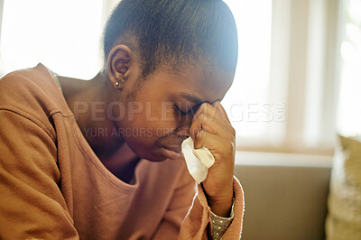 Buy stock photo Sad, crying and black girl with depression in home, anxiety or mental health problem. Depressed, stress and African person, kid or teenager with tissue for tears, bad news or grief, loss or tragedy.