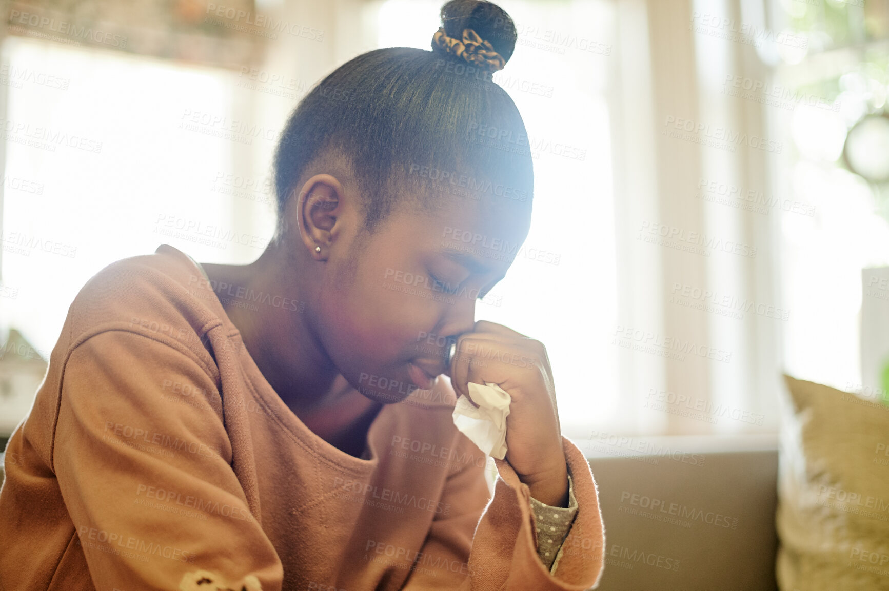 Buy stock photo Sad, crying and black girl with depression in home, anxiety or mental health problem. Depressed, stress and African person, kid or teenager with tissue for tears, bad news or grief, loss or tragedy.