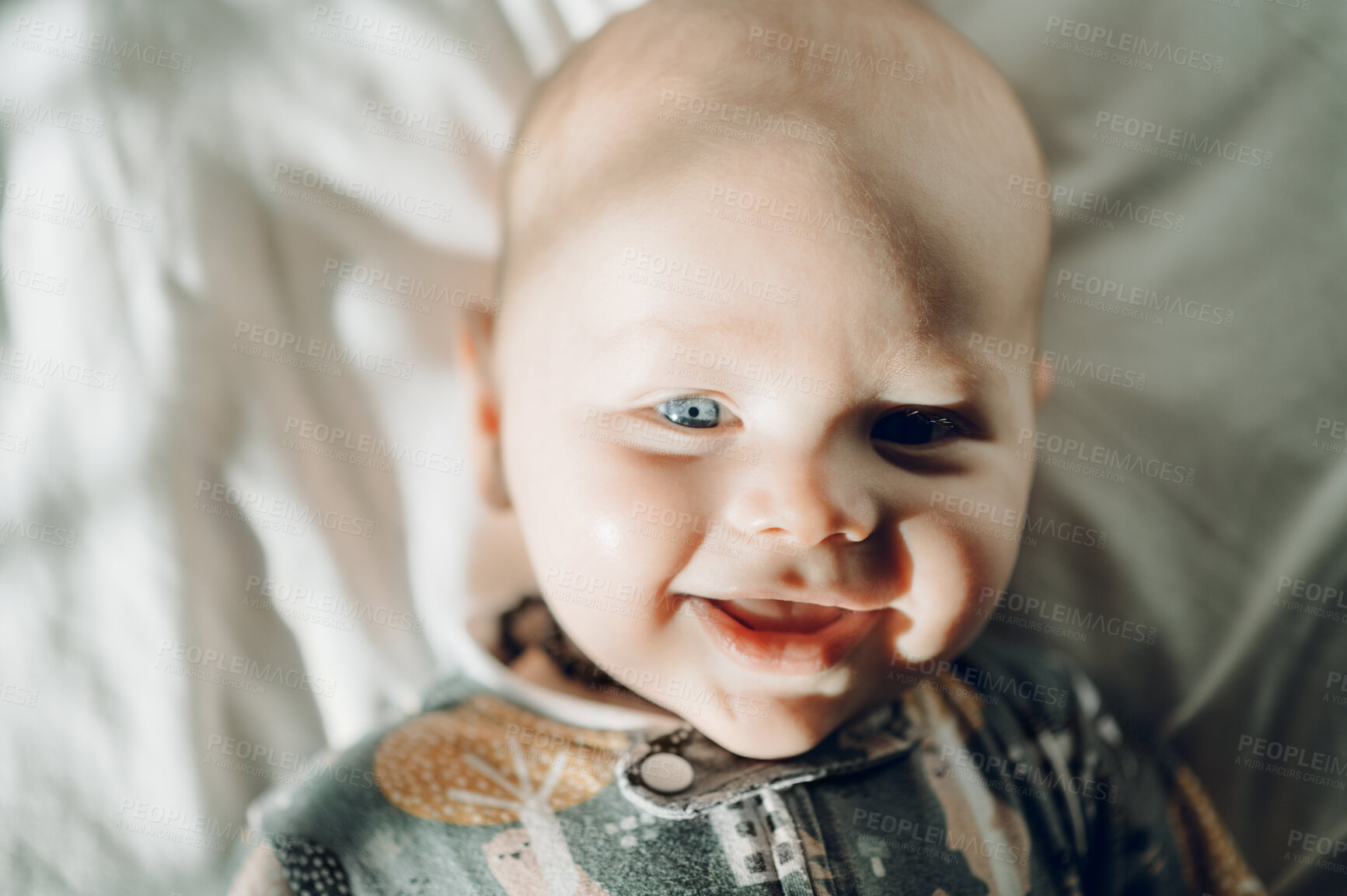 Buy stock photo Baby smile, portrait and newborn closeup in a home bedroom, nursery and duvet. House, healthy young child and infant ready for sleeping, rest and relaxing in the sun with a toddler feeling relax