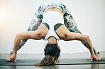 Yoga, stretching and woman flexibility on a pilates mat with fitness and meditation feeling relax. Wellness, mindfulness and exercise of a young and calm female with peace on a floor for workout