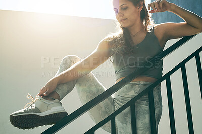 Buy stock photo Fitness, woman and stretching legs on rail in preparation for workout, exercise or running outdoors. Sporty, fit or active female in warm up leg stretch or foot getting ready for exercising by stairs