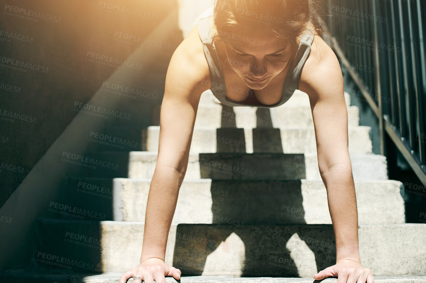 Buy stock photo Plank, stairs and woman athlete doing arm exercise, workout and gym routine for strength. Female, lens flare and person with sports training, wellness and health for strong arms and sport exercising